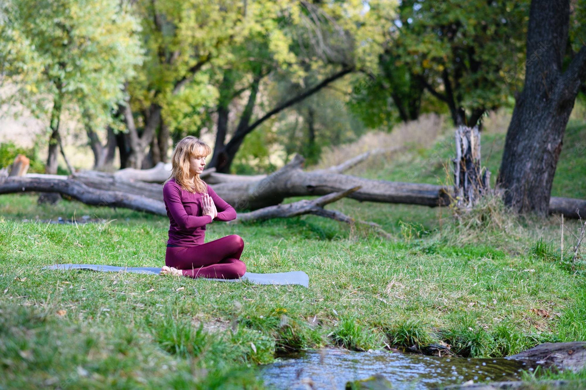 Premium Photo | Healthy fit woman make yoga meditation with namaste in green forest with tree trunk and water stream outdoor fitness activity Premium Photo | Healthy fit woman make yoga meditation with namaste in green forest with tree trunk and water stream outdoor fitness activity